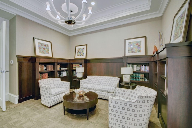 living area featuring a notable chandelier and crown molding