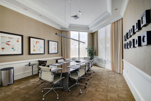 dining room featuring ornamental molding and a tray ceiling