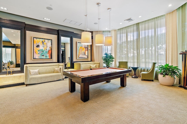 recreation room with light colored carpet and pool table