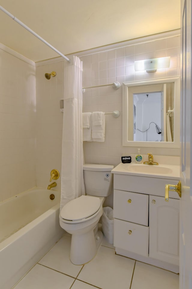 full bathroom featuring vanity, tile patterned flooring, toilet, tile walls, and shower / tub combo with curtain