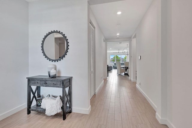 corridor featuring light hardwood / wood-style floors