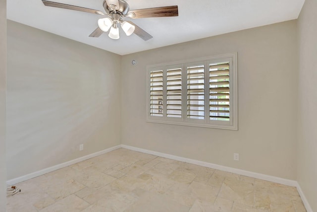 spare room with ceiling fan