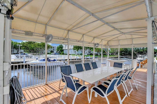 wooden deck featuring a water view