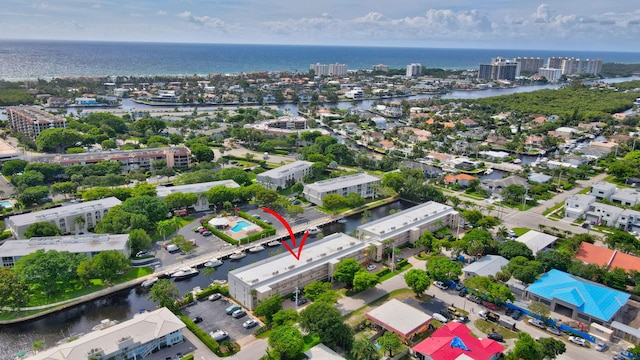 birds eye view of property featuring a water view