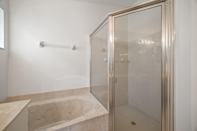 bathroom with separate shower and tub