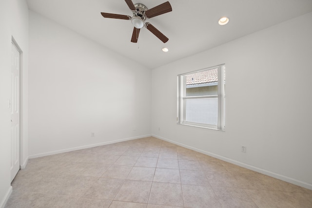 tiled empty room with ceiling fan