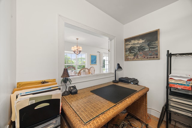 office area with an inviting chandelier