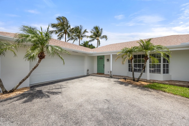 ranch-style house featuring a garage