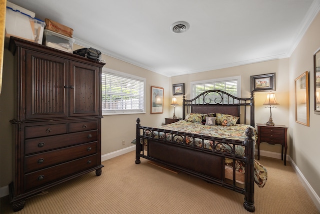 carpeted bedroom with multiple windows and ornamental molding