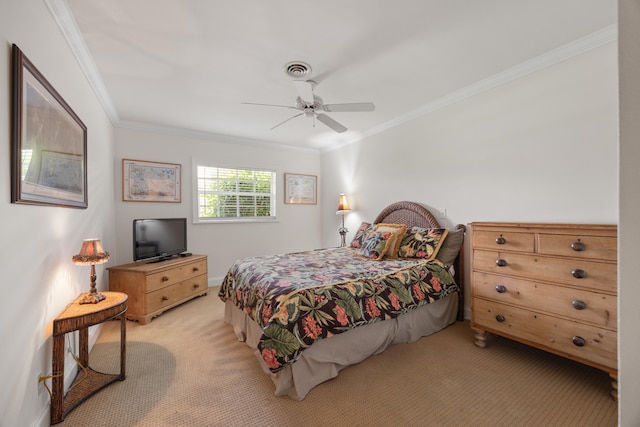 carpeted bedroom featuring ceiling fan and crown molding