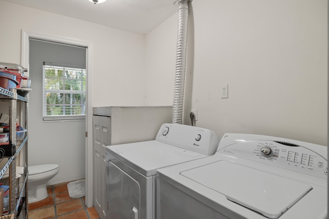 washroom with independent washer and dryer, hookup for an electric dryer, and tile floors