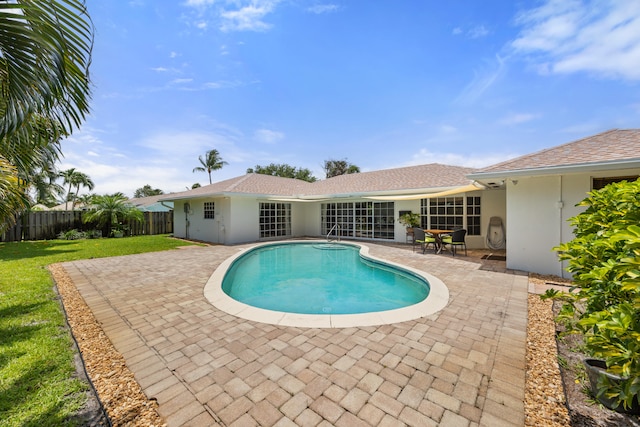 view of swimming pool with a patio area