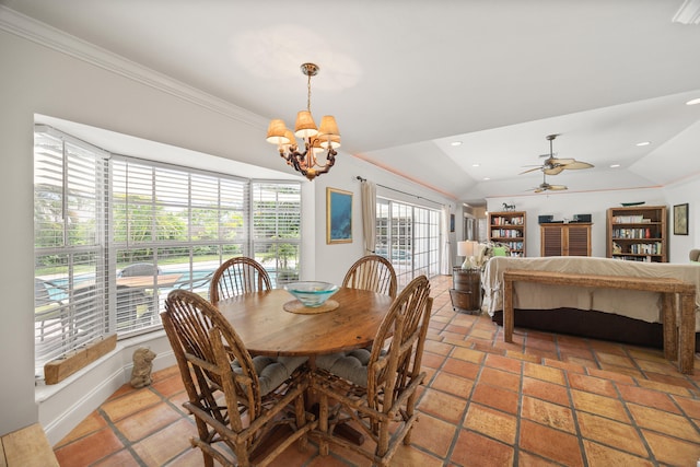 tiled dining space featuring vaulted ceiling, plenty of natural light, and ceiling fan with notable chandelier