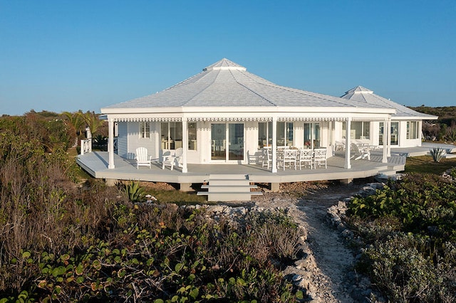 back of property featuring a wooden deck