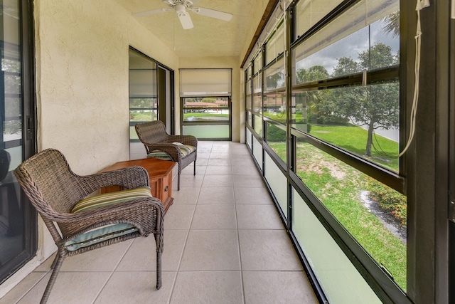 sunroom with a wealth of natural light and ceiling fan