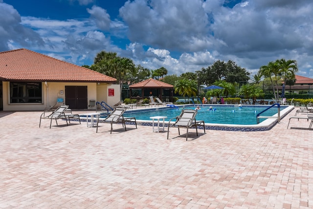 view of swimming pool with a patio