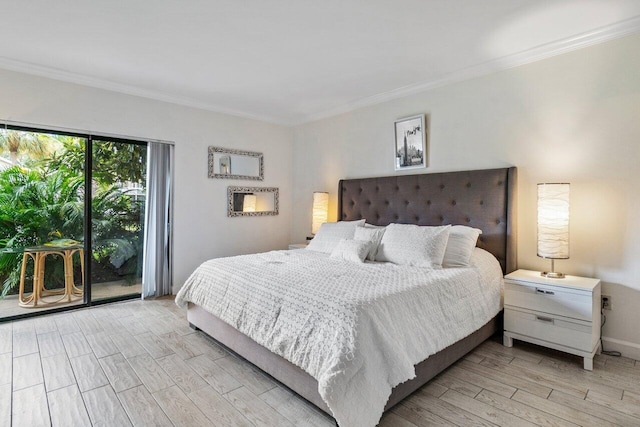 bedroom featuring light hardwood / wood-style floors, access to exterior, and ornamental molding