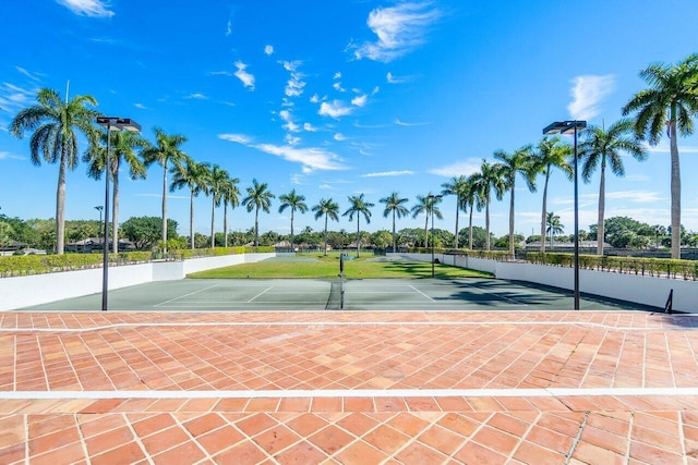 view of sport court featuring tennis court