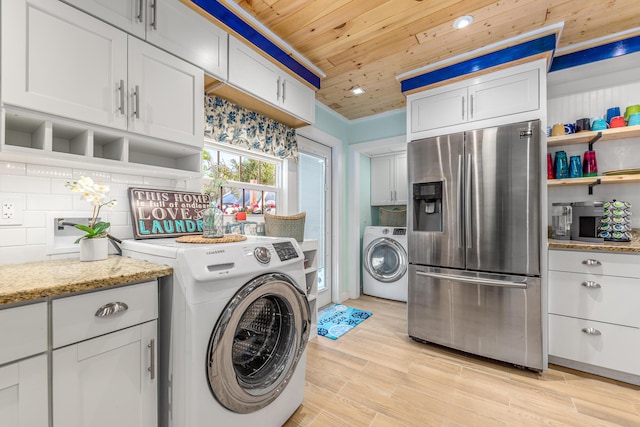 clothes washing area featuring washer / clothes dryer, wood ceiling, and light hardwood / wood-style flooring