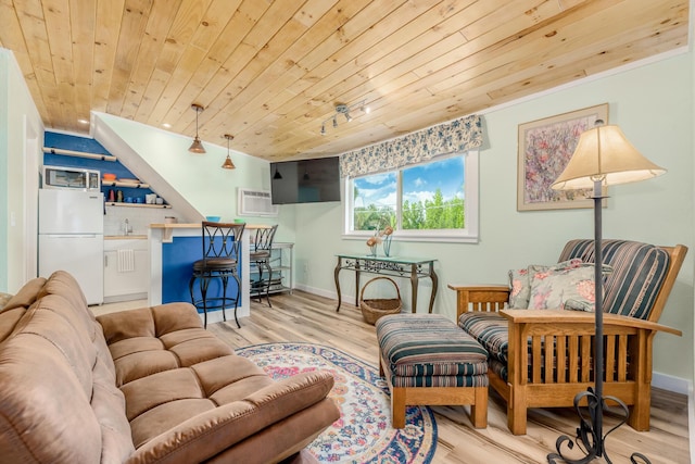 living room featuring light hardwood / wood-style floors, wooden ceiling, an AC wall unit, and indoor bar