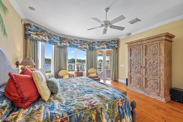 bedroom featuring access to exterior, ceiling fan, hardwood / wood-style floors, and crown molding