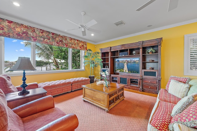 living room featuring ceiling fan and crown molding