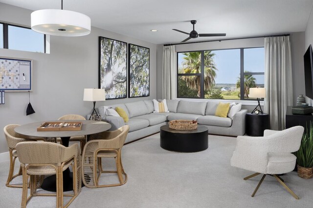 living room featuring carpet floors and ceiling fan