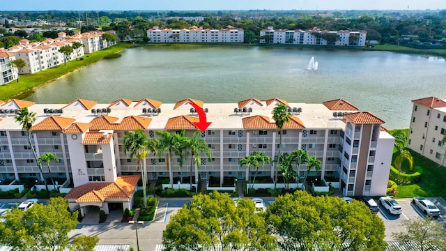 birds eye view of property with a water view