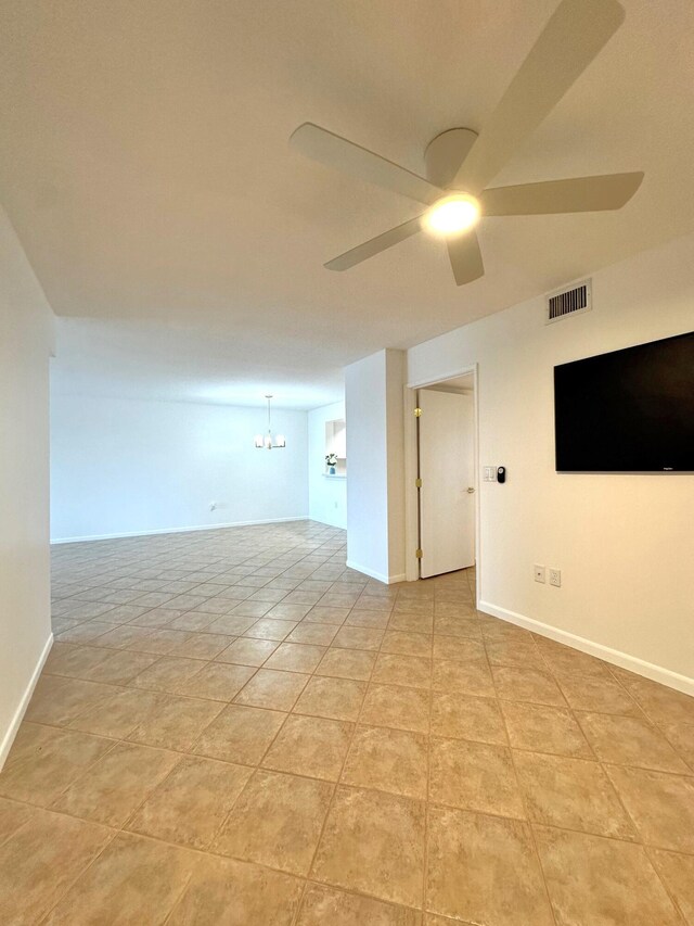 interior space with light tile patterned flooring and ceiling fan