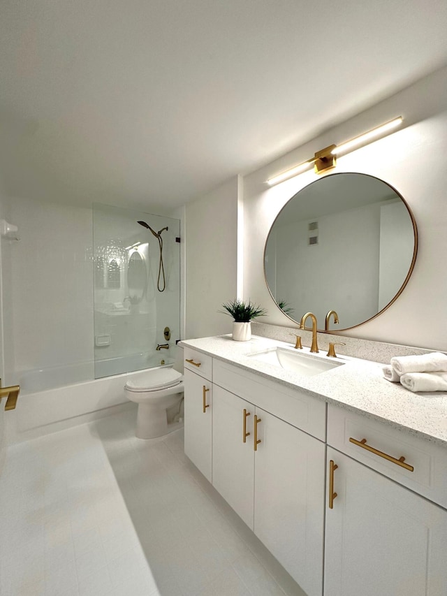 full bathroom featuring vanity, tiled shower / bath combo, toilet, and tile patterned floors