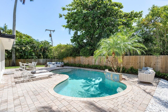 view of swimming pool featuring outdoor lounge area and a patio