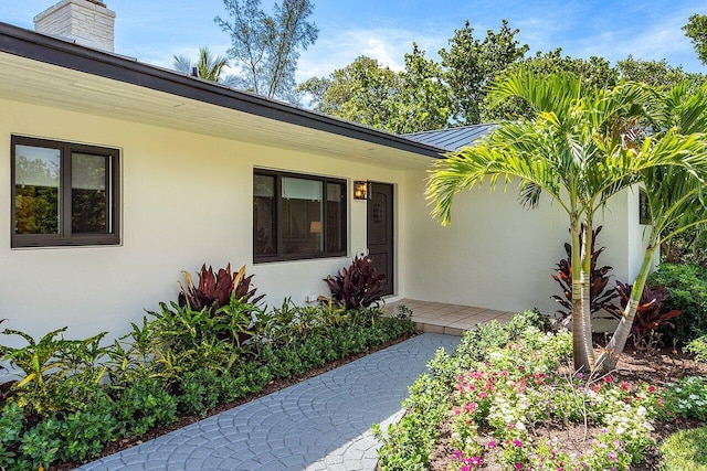 doorway to property featuring a porch