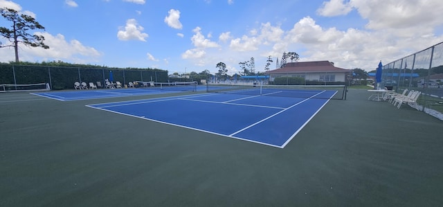 view of sport court featuring basketball hoop