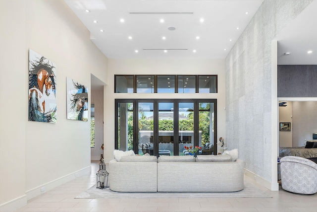 living room with a high ceiling