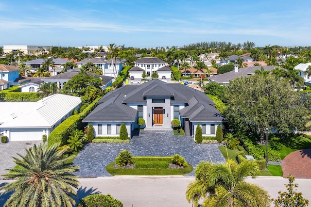 birds eye view of property with a residential view