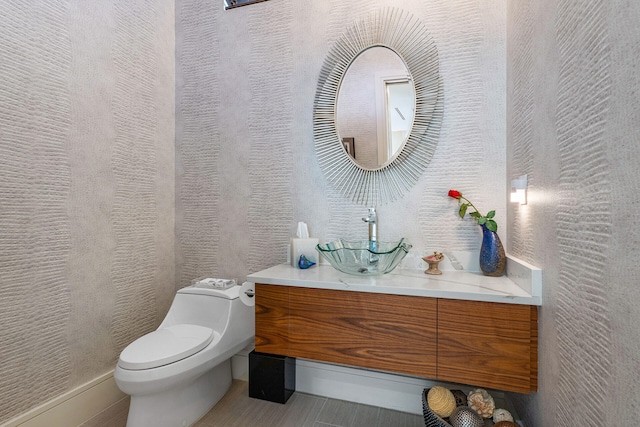 bathroom with vanity and toilet