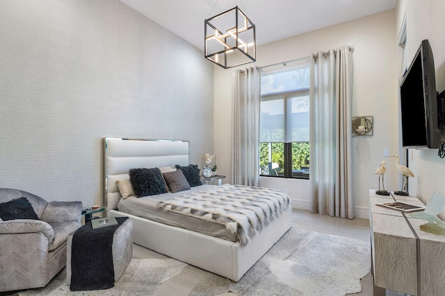 bedroom featuring a notable chandelier