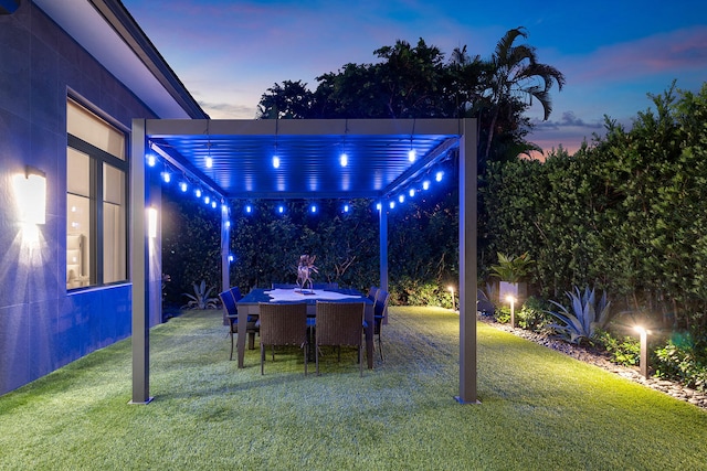 yard at dusk featuring a patio area