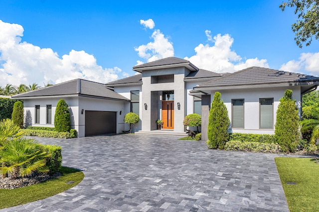 prairie-style home featuring a garage