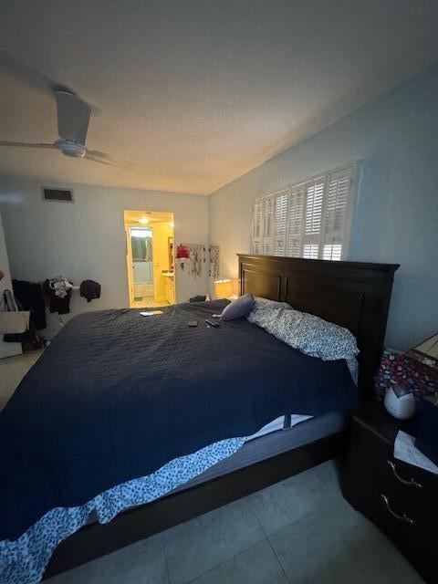 bedroom featuring tile floors and ceiling fan