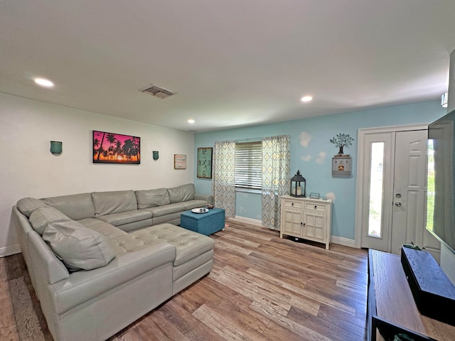 bedroom with wood-type flooring, ceiling fan, and a textured ceiling