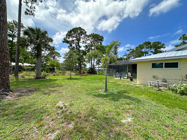 view of yard featuring a lanai