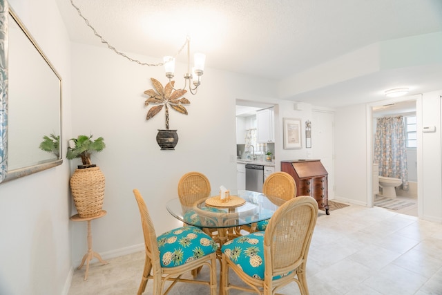 dining room with an inviting chandelier and baseboards