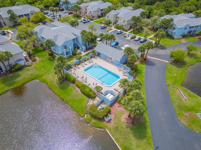 bird's eye view with a residential view and a water view