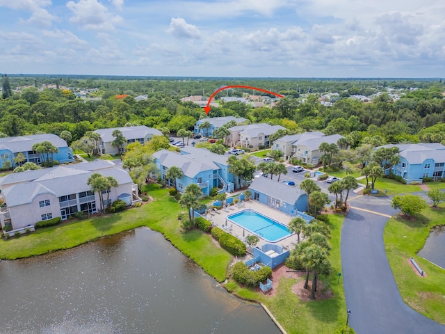 aerial view featuring a residential view and a water view