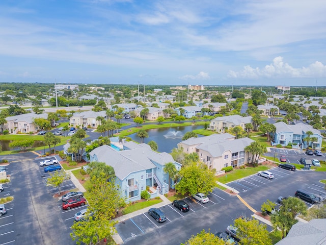 drone / aerial view with a residential view and a water view