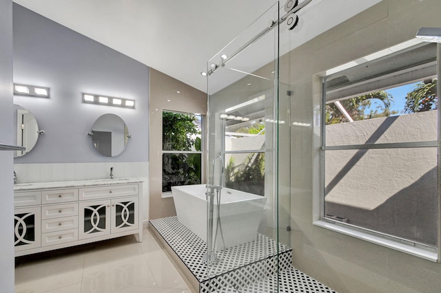 bathroom with shower with separate bathtub, tile patterned flooring, dual bowl vanity, and vaulted ceiling