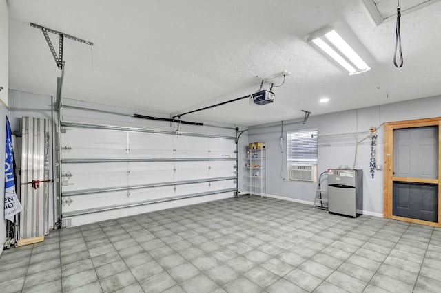 garage with cooling unit, a garage door opener, and stainless steel fridge