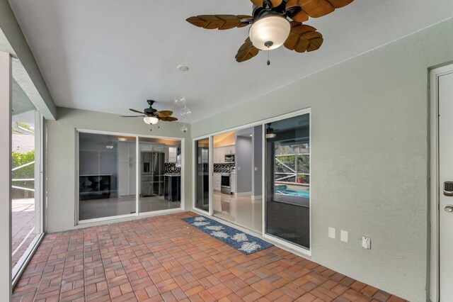 view of patio with ceiling fan