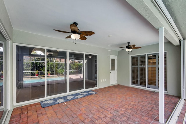 view of patio featuring ceiling fan